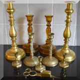 D04. Brass and amber glass candlesticks. 